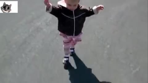 girl plays with shadow for the first time and falls cutely