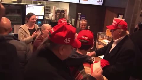 Donald trump buying mc donald and giving away free hat.