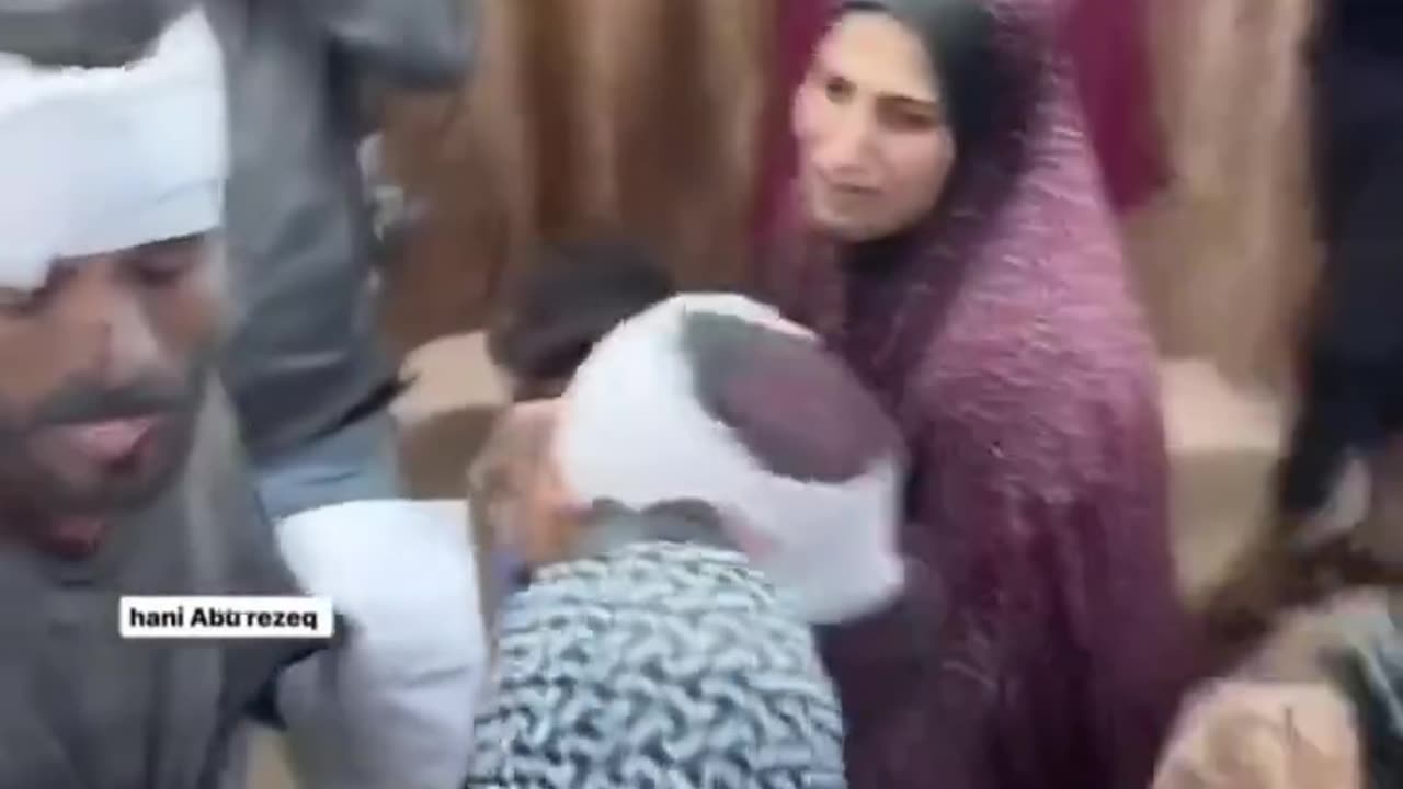 This is Pallywood: Camera crew, bandage over hijab, everybody going wild.