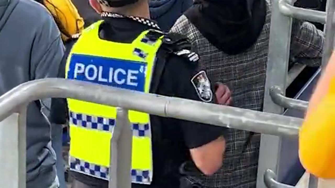 : Intense moment pitch invader is stopped by a soccer fan