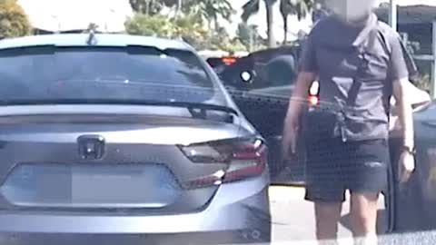Man kicks parcels around HDB void deck