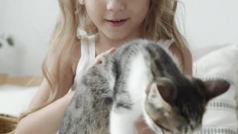 Girl Holding a Cat