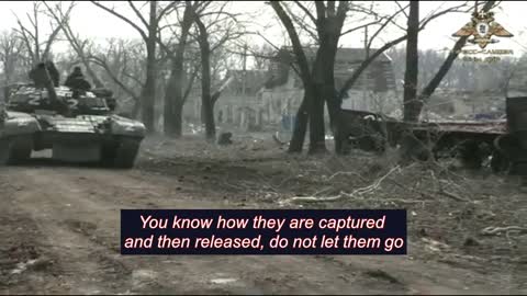 Woman telling the Russians what to do with Azov prisoners