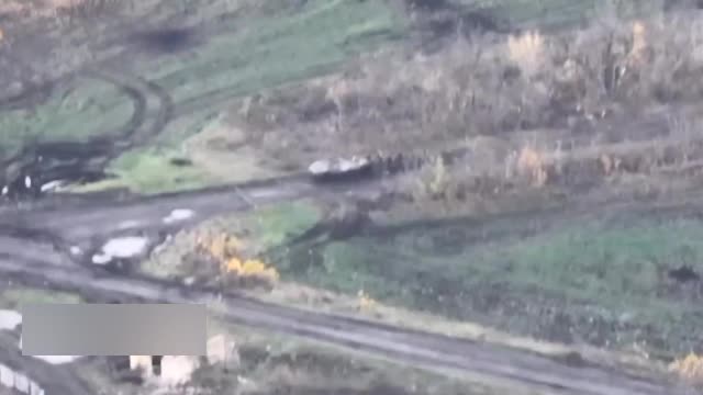 Ukrainian armored vehicle steps on a mine with infantry taking cover behind