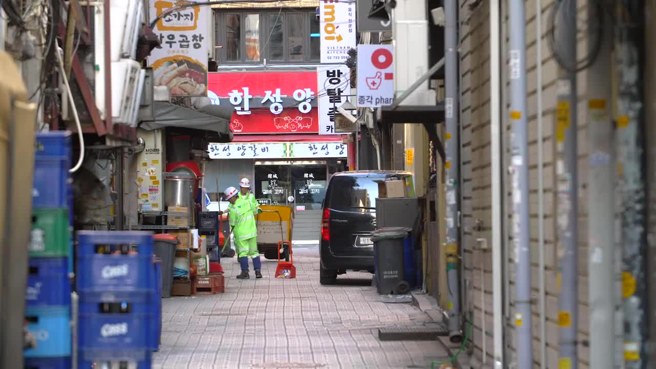 Street Cleaners Working in Back Street
