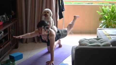 Asian woman doing sport with dog