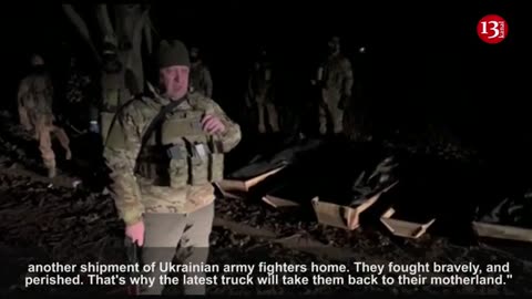 Ukraine forces loading dead bodies