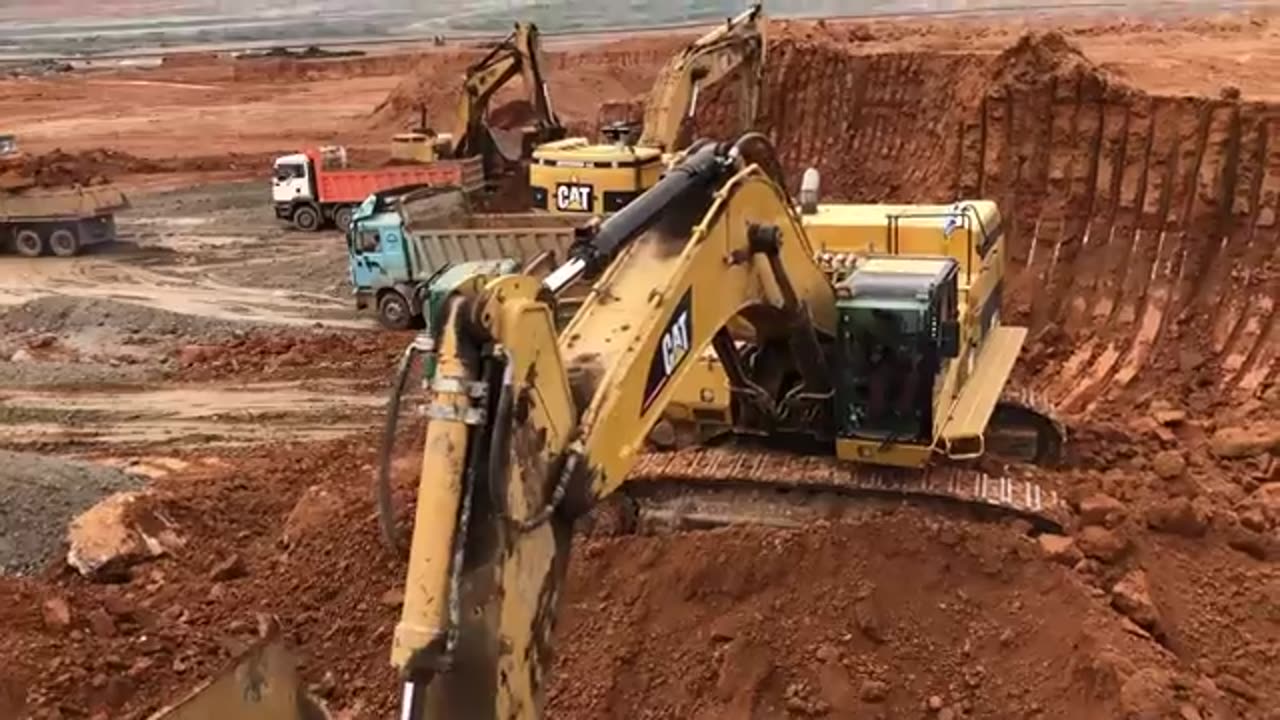 Caterpillar 365C Excavator Loading Trucks And Operator View