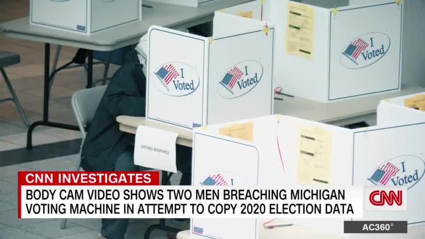 Watch these men pose as officials and try to copy 2020 election data from a voting machine