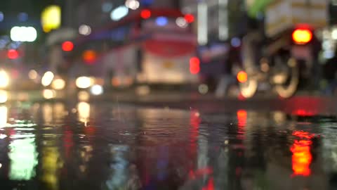 Brake Lights Reflected in Rain