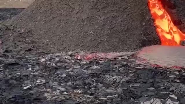 Nothing fancy, just the Icelanders are playing volleyball at the foot of an erupting volcano