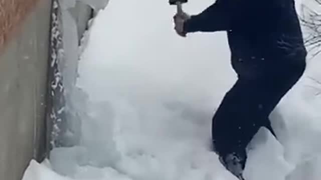 Smashing ice from roof drain work