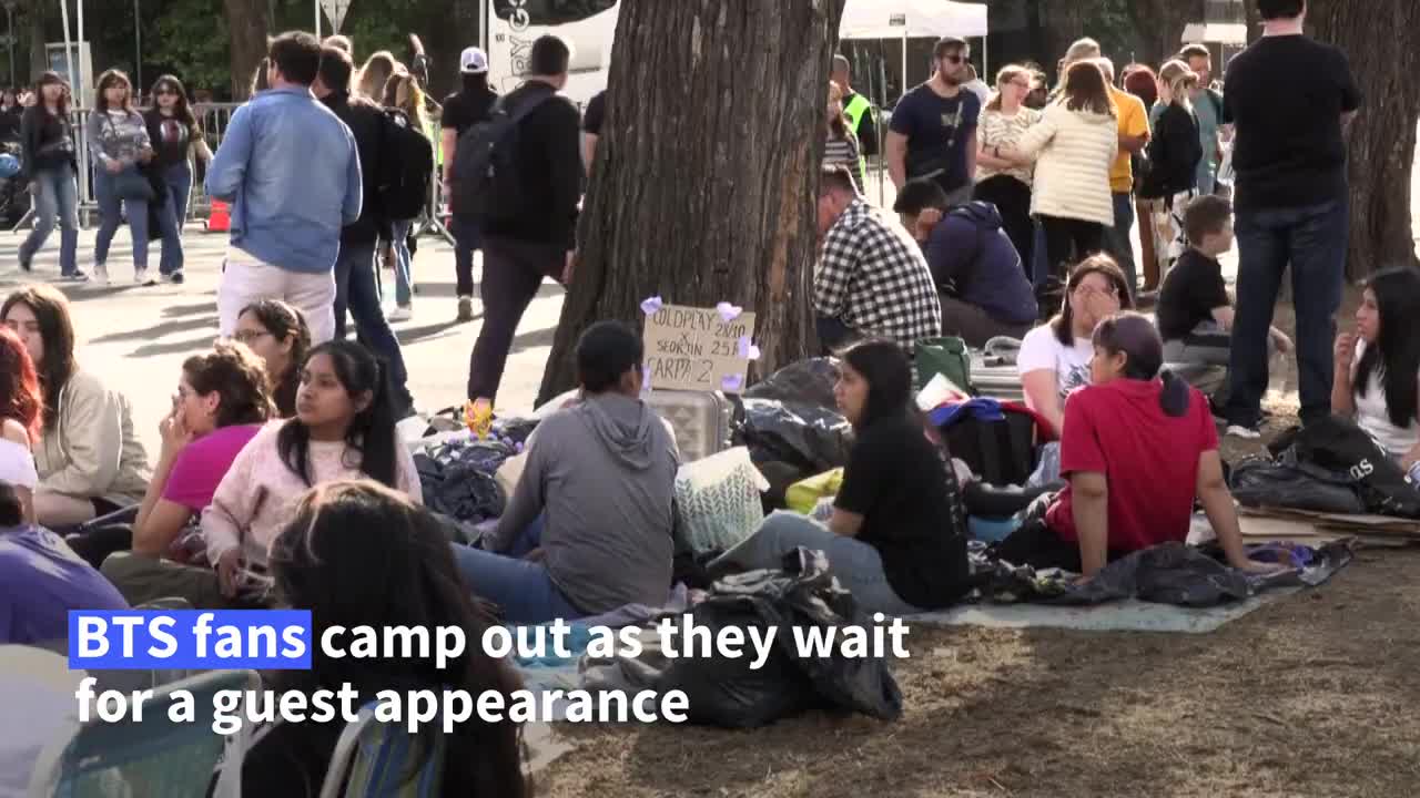 BTS fans camp out to see superstar Jin perform with Coldplay | AFP