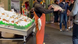 Employees Toss Fish at Seattle Fish Market