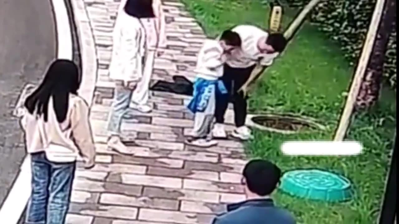 Mother disciplines son after he jumped down manhole