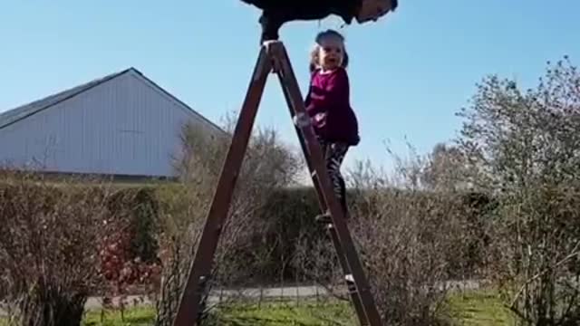 Man Shows Handstand On Top Of Ladder And Gets Accompanied By His Daughter