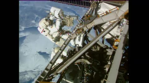 international space station astronauts conduct third spacewalk in eight days.