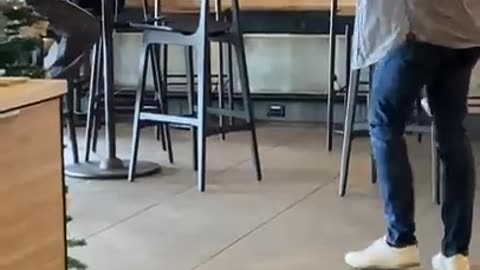 Man doing magic tricks at Starbucks