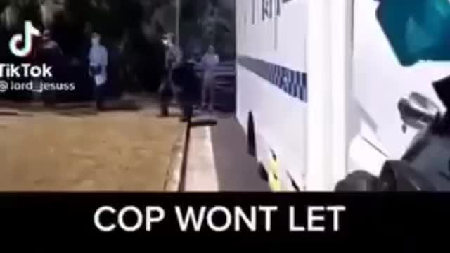 Aussie cop won’t let a paramedic treat an injured man.