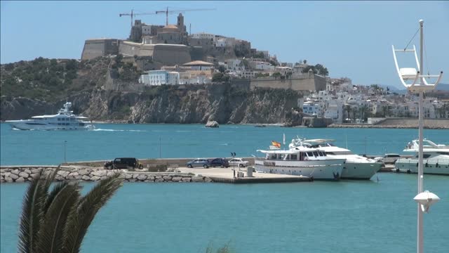 boats cruising throughout harbor in spain