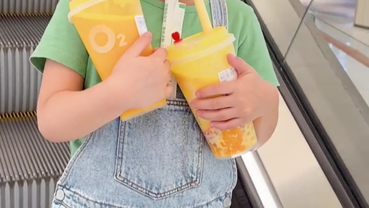 cute baby drinking juice