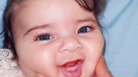 Cute baby first smile for mom