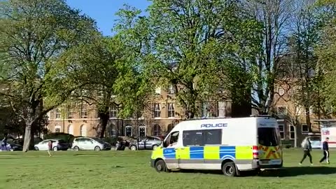 A police loudspeaker blares: “No sunbathing! Exercise only!”