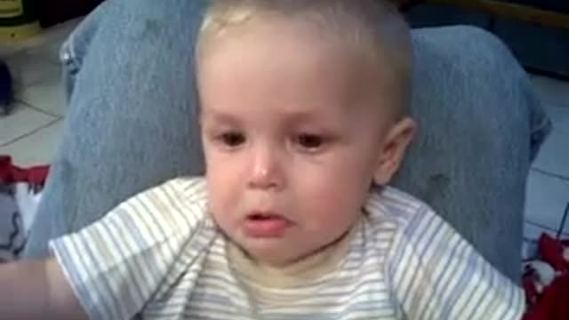 Cute baby crying at cow noise