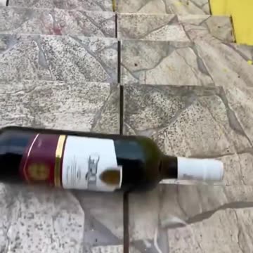 Breaking glass bottle