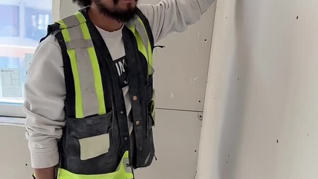 Rescuing a Pidgeon From Inside Wall at Construction Site