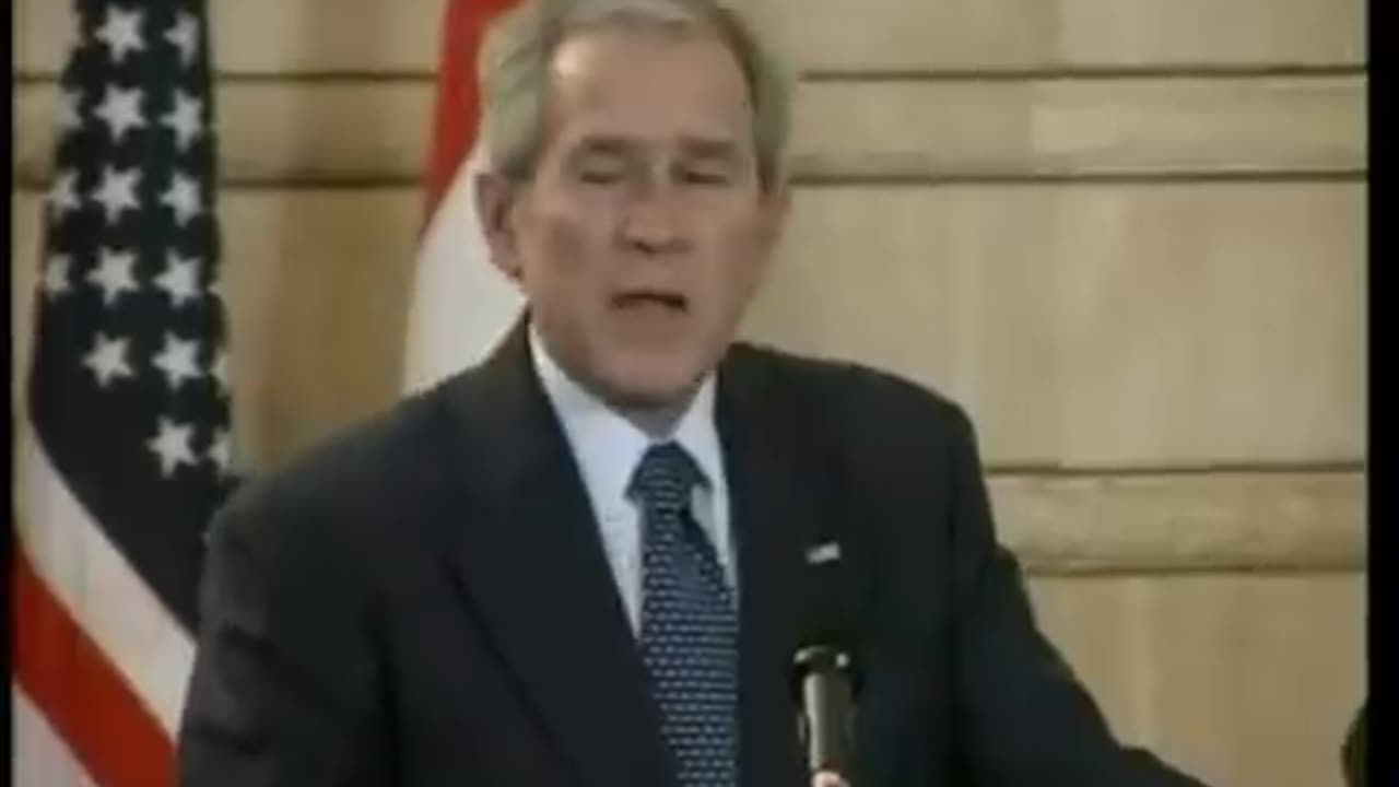 President Bush ducks at the podium as a shoe is thrown at him in Baghdad December 14, 2008