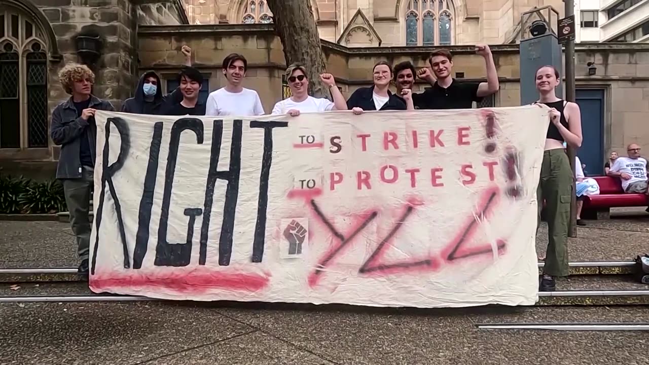 Climate activists in Australia protest in rain