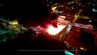 Drone footage shows burning Lima building