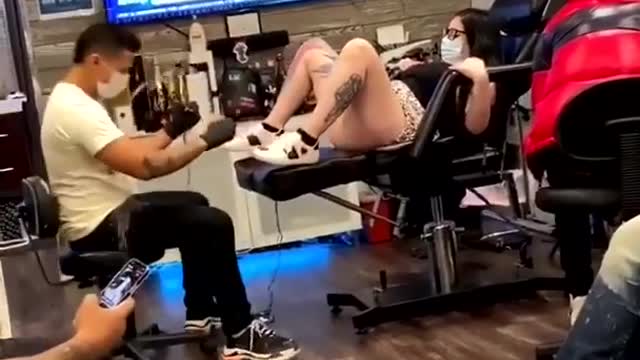 Funny reaction of girl while having tattoo. #Funnytattoo reactions.