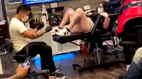 Funny reaction of girl while having tattoo. #Funnytattoo reactions.