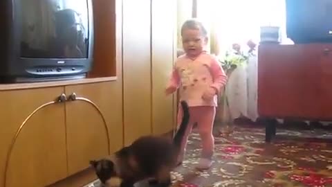 Mother Cat Reclaims Crying Kitten from Young Child