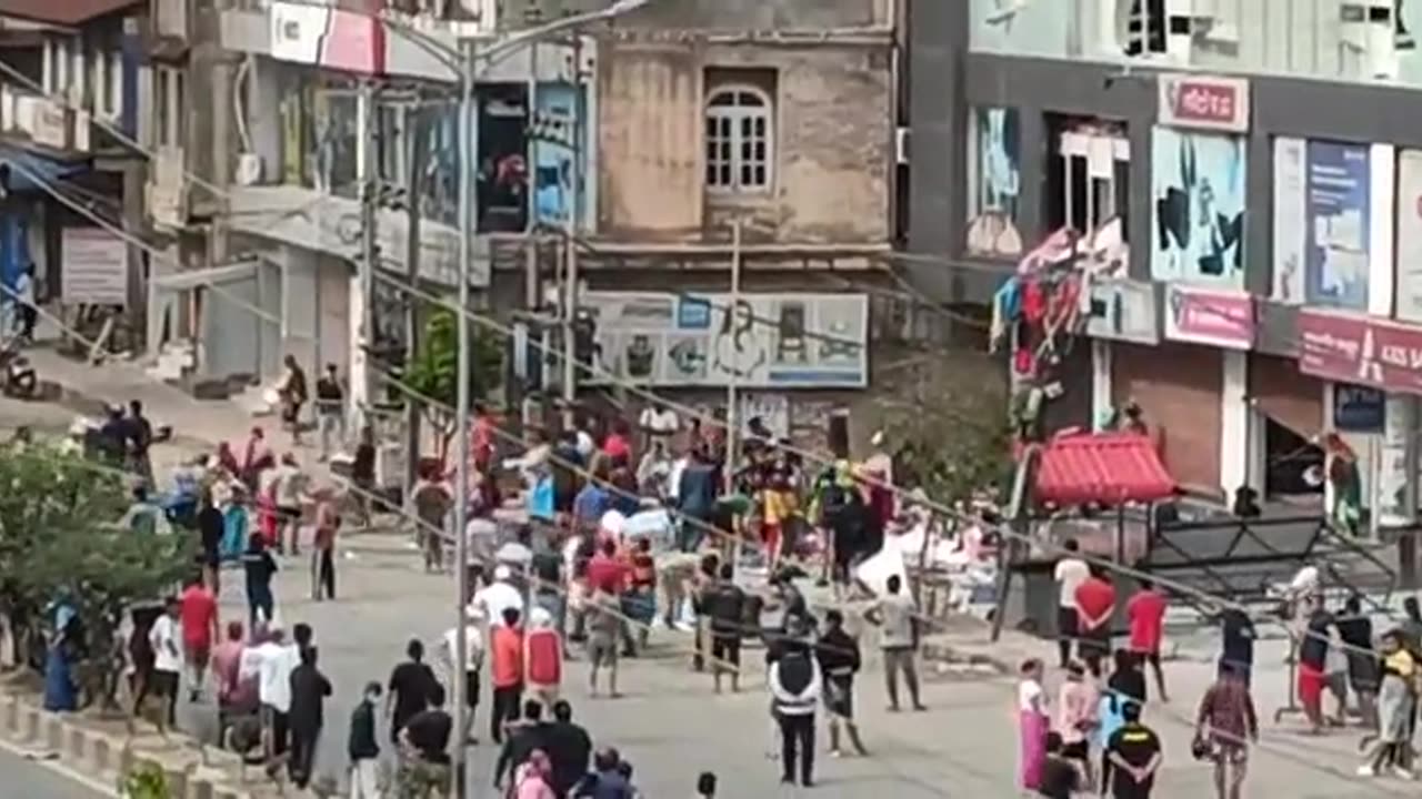 shopping mall being looted in daylight in Imphal, Manipur, India