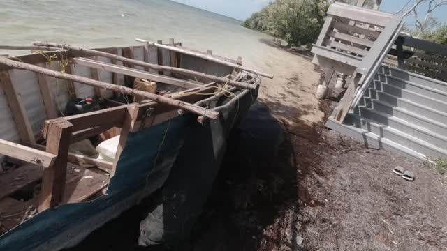 AMAZING RARE EVENT- A CUBAN REFUGEE BOAT? BEACHED AT ANNE'S BEACH IN THE FLORIDA KEYS