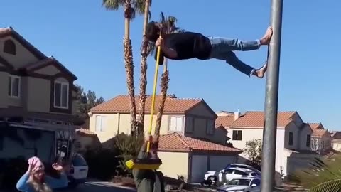 Walking on a light pole