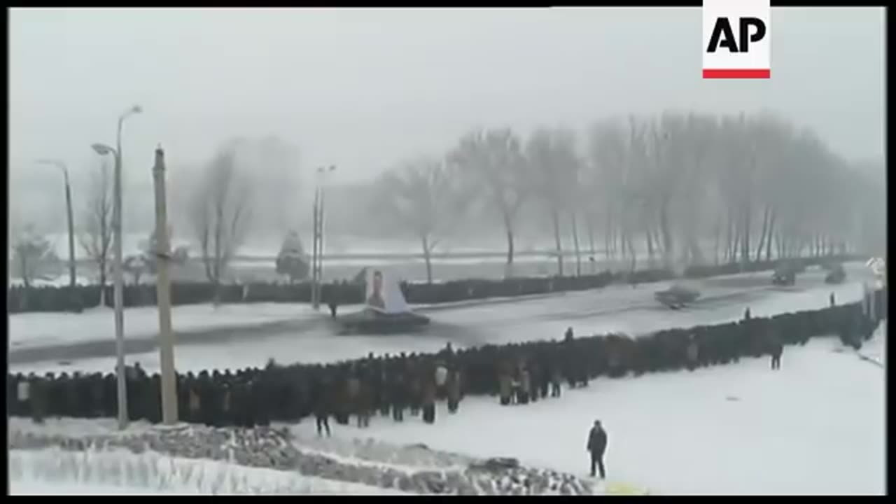 Scenes of mass grief as mourners line streets at funeral for Kim Jong-il