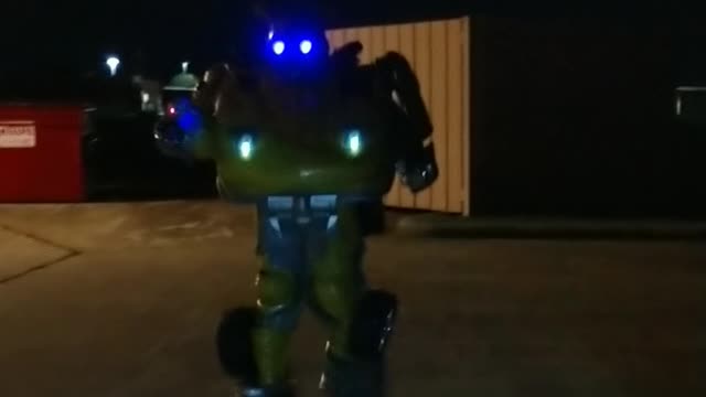 Walk in the dark with a yellow robot superhero mascot bumblebee at bouncing bears spring Texas