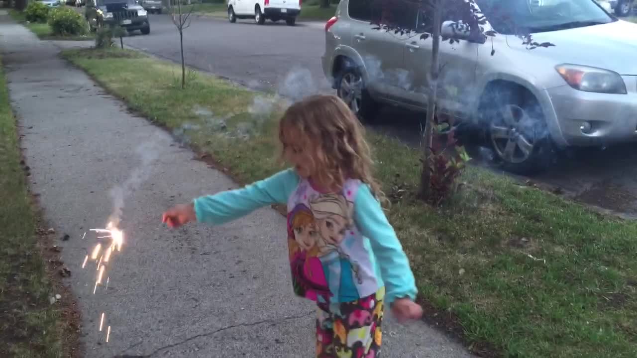 Two Kids Singing and Play With Sparklers on 4th of July