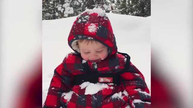 Baby Laughs After Getting Covered In Snow