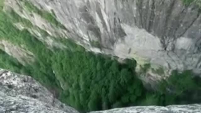 Extreme bungee jumping session off of insane cliff