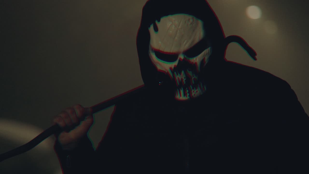 a maskman hold crowbar in hand