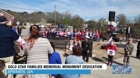 Mayor Sharon Sewell and Col. Wayne Waddell speak at the unveiling of the Gold Star Family Memorial