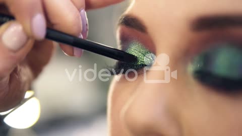 Extremely Close Applying Shine Bright Green Shadows On Eye Corner