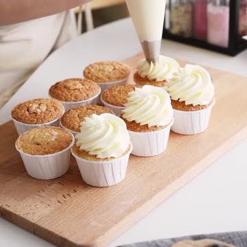 A Woman Putting Icing on the Cupcakes #shorts