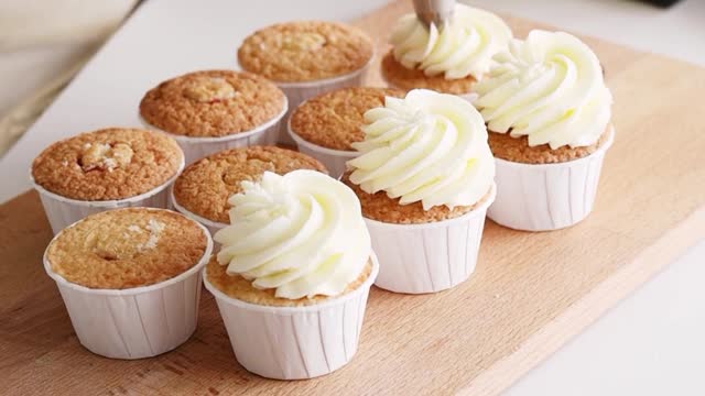 A Woman Putting Icing on the Cupcakes #shorts