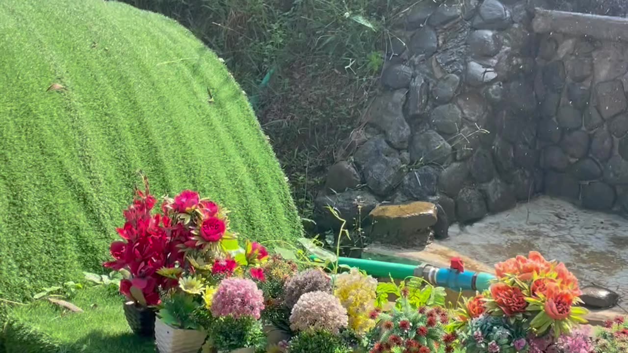 Artificial flowers and fountain